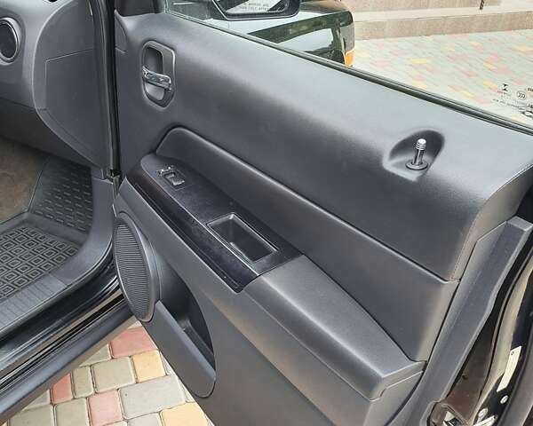 Черный Джип Патриот, объемом двигателя 2.36 л и пробегом 155 тыс. км за 10500 $, фото 11 на Automoto.ua