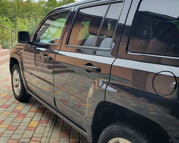 Черный Джип Патриот, объемом двигателя 2.36 л и пробегом 155 тыс. км за 10500 $, фото 1 на Automoto.ua