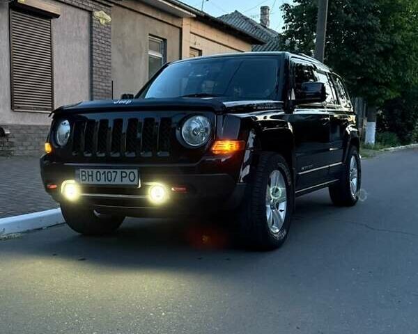 Черный Джип Патриот, объемом двигателя 2.4 л и пробегом 84 тыс. км за 15000 $, фото 1 на Automoto.ua