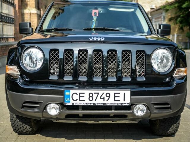 Черный Джип Патриот, объемом двигателя 2.4 л и пробегом 102 тыс. км за 10800 $, фото 1 на Automoto.ua