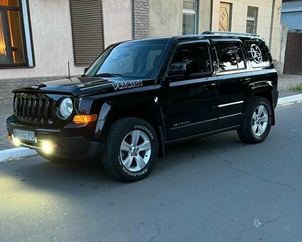 Черный Джип Патриот, объемом двигателя 2.4 л и пробегом 84 тыс. км за 15000 $, фото 2 на Automoto.ua