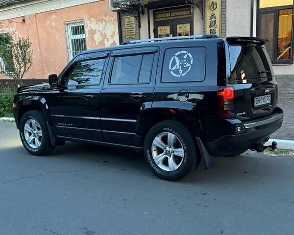 Черный Джип Патриот, объемом двигателя 2.4 л и пробегом 84 тыс. км за 15000 $, фото 3 на Automoto.ua