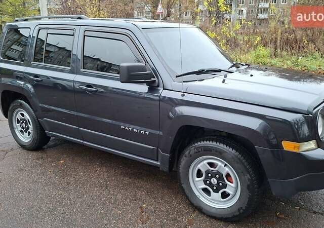 Черный Джип Патриот, объемом двигателя 2.36 л и пробегом 187 тыс. км за 10800 $, фото 1 на Automoto.ua
