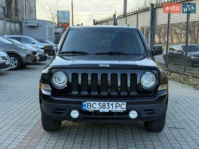 Чорний Джип Patriot, об'ємом двигуна 2.4 л та пробігом 128 тис. км за 10300 $, фото 1 на Automoto.ua