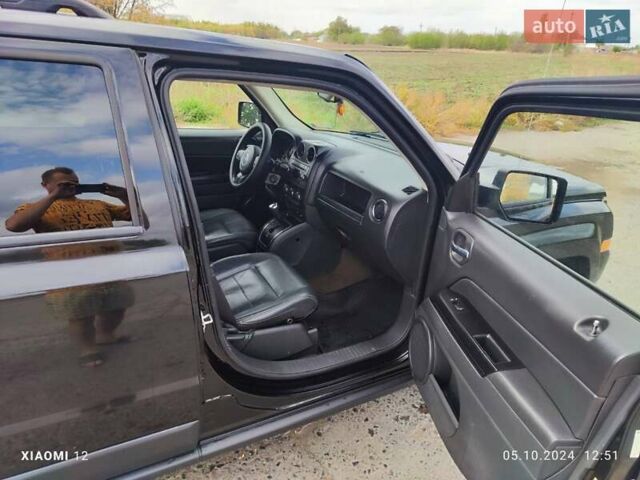 Черный Джип Патриот, объемом двигателя 2.4 л и пробегом 182 тыс. км за 10400 $, фото 5 на Automoto.ua