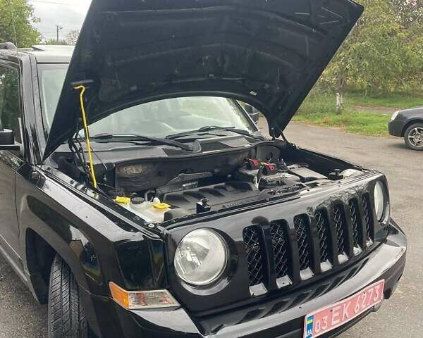 Черный Джип Патриот, объемом двигателя 2.4 л и пробегом 182 тыс. км за 10400 $, фото 8 на Automoto.ua