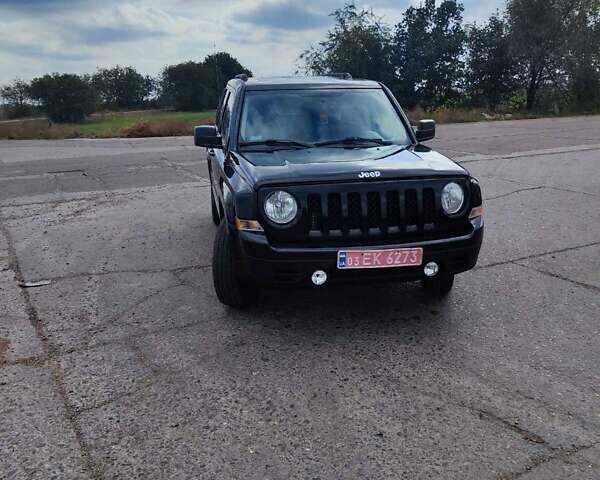 Черный Джип Патриот, объемом двигателя 2.4 л и пробегом 182 тыс. км за 10400 $, фото 1 на Automoto.ua