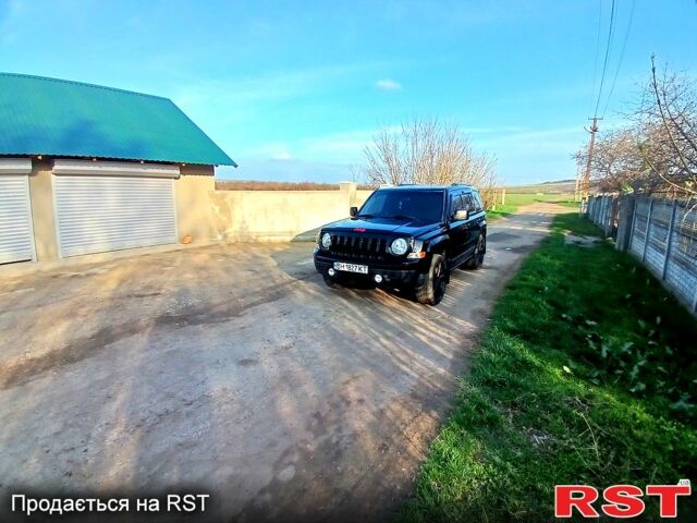 Черный Джип Патриот, объемом двигателя 2 л и пробегом 114 тыс. км за 11500 $, фото 2 на Automoto.ua