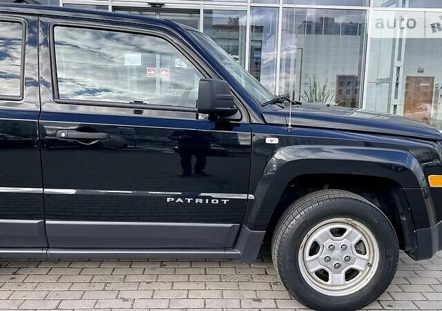 Чорний Джип Patriot, об'ємом двигуна 2.4 л та пробігом 161 тис. км за 9950 $, фото 4 на Automoto.ua