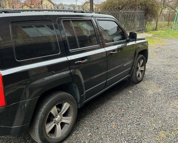 Черный Джип Патриот, объемом двигателя 2.36 л и пробегом 167 тыс. км за 10200 $, фото 3 на Automoto.ua