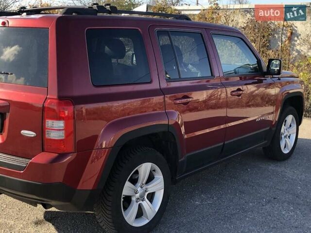 Красный Джип Патриот, объемом двигателя 2.4 л и пробегом 208 тыс. км за 9500 $, фото 1 на Automoto.ua