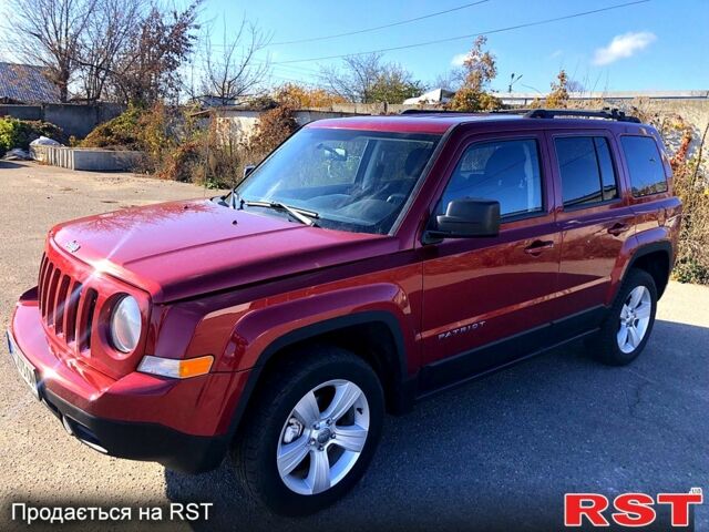 Красный Джип Патриот, объемом двигателя 2.4 л и пробегом 205 тыс. км за 9000 $, фото 1 на Automoto.ua