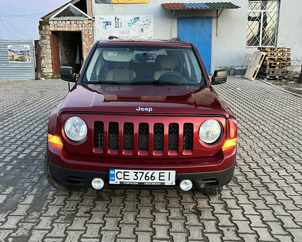 Червоний Джип Patriot, об'ємом двигуна 2.4 л та пробігом 150 тис. км за 10250 $, фото 2 на Automoto.ua