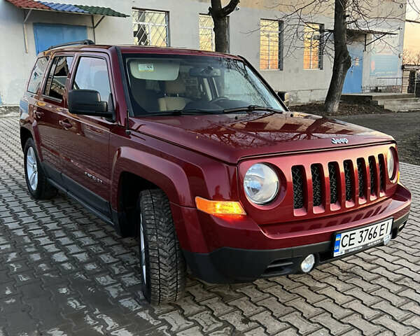 Червоний Джип Patriot, об'ємом двигуна 2.4 л та пробігом 150 тис. км за 10250 $, фото 3 на Automoto.ua