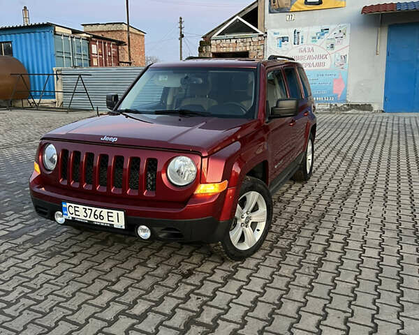 Червоний Джип Patriot, об'ємом двигуна 2.4 л та пробігом 150 тис. км за 10250 $, фото 1 на Automoto.ua