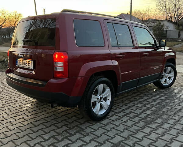 Червоний Джип Patriot, об'ємом двигуна 2.4 л та пробігом 150 тис. км за 10250 $, фото 5 на Automoto.ua