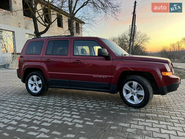 Червоний Джип Patriot, об'ємом двигуна 2.4 л та пробігом 150 тис. км за 10250 $, фото 4 на Automoto.ua