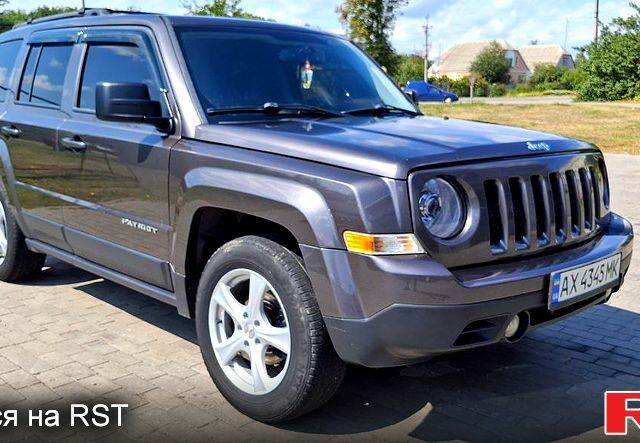 Серый Джип Патриот, объемом двигателя 2.4 л и пробегом 154 тыс. км за 11000 $, фото 1 на Automoto.ua