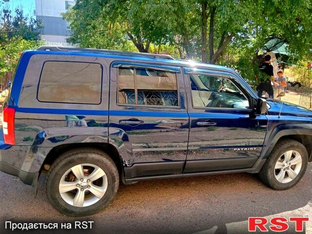 Синий Джип Патриот, объемом двигателя 2.4 л и пробегом 130 тыс. км за 9600 $, фото 1 на Automoto.ua