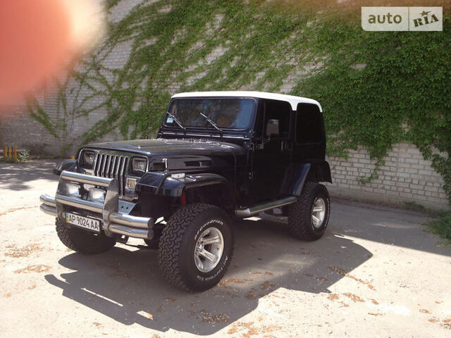 Чорний Джип Wrangler, об'ємом двигуна 2.5 л та пробігом 50 тис. км за 10000 $, фото 1 на Automoto.ua