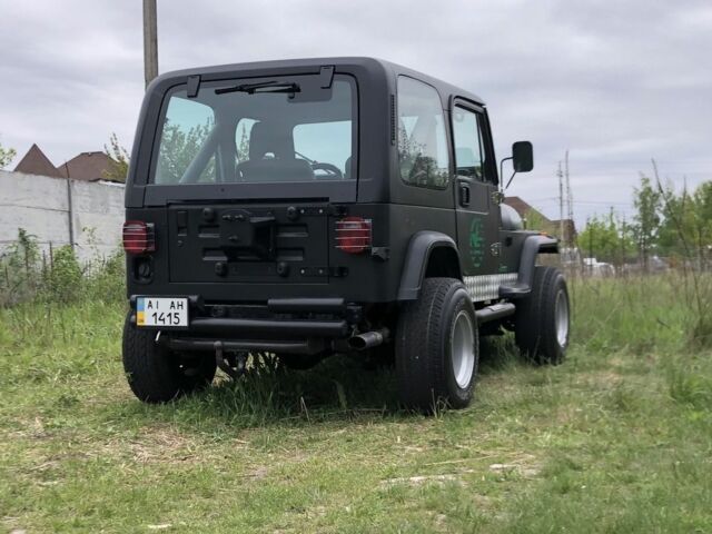 Чорний Джип Wrangler, об'ємом двигуна 4 л та пробігом 1 тис. км за 10000 $, фото 7 на Automoto.ua