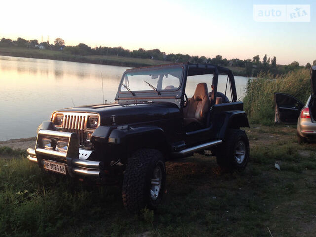 Чорний Джип Wrangler, об'ємом двигуна 2.5 л та пробігом 50 тис. км за 10000 $, фото 13 на Automoto.ua