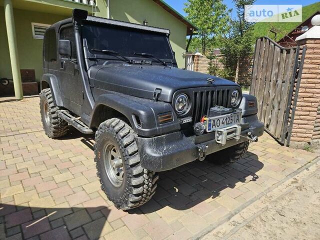 Чорний Джип Wrangler, об'ємом двигуна 3.96 л та пробігом 227 тис. км за 15000 $, фото 10 на Automoto.ua