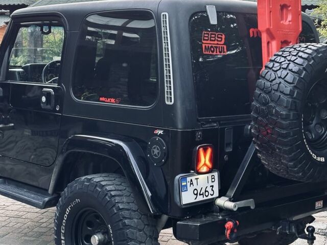 Чорний Джип Wrangler, об'ємом двигуна 4 л та пробігом 118 тис. км за 18900 $, фото 3 на Automoto.ua