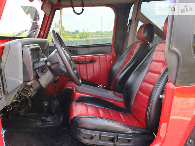 Червоний Джип Wrangler, об'ємом двигуна 4.2 л та пробігом 160 тис. км за 15500 $, фото 23 на Automoto.ua