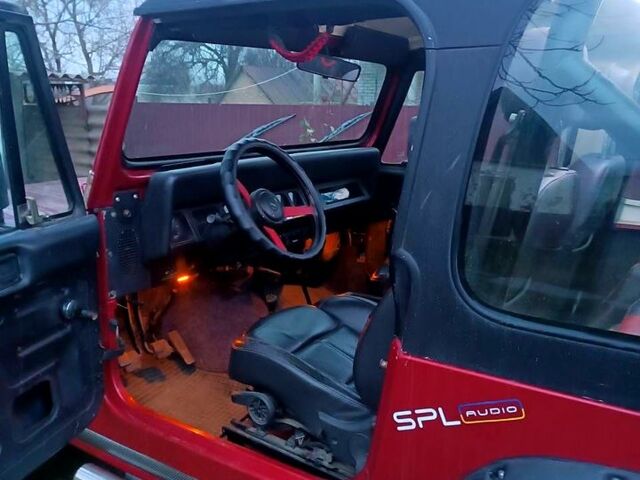 Красный Джип Вранглер, объемом двигателя 4 л и пробегом 200 тыс. км за 14500 $, фото 5 на Automoto.ua