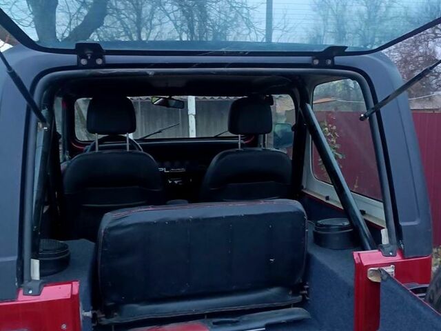 Красный Джип Вранглер, объемом двигателя 4 л и пробегом 200 тыс. км за 14500 $, фото 7 на Automoto.ua