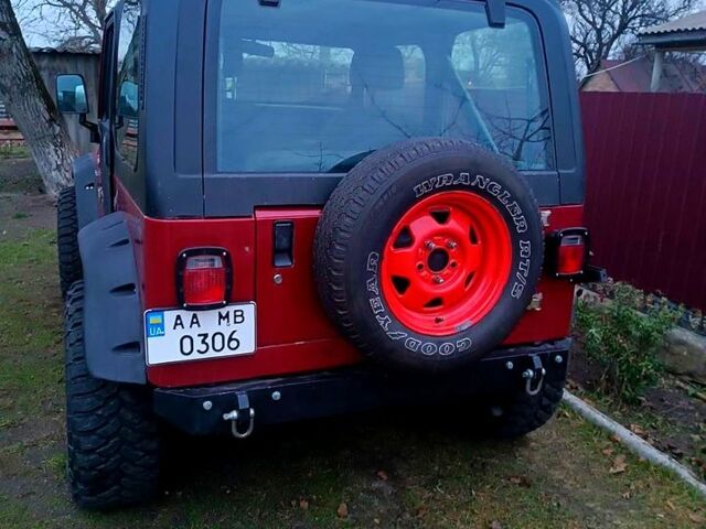 Красный Джип Вранглер, объемом двигателя 4 л и пробегом 200 тыс. км за 14500 $, фото 8 на Automoto.ua