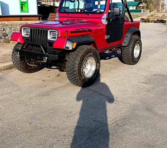 Красный Джип Вранглер, объемом двигателя 4 л и пробегом 200 тыс. км за 14500 $, фото 1 на Automoto.ua