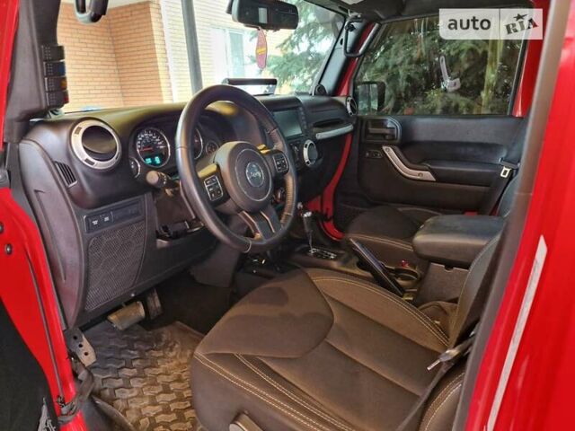 Червоний Джип Wrangler, об'ємом двигуна 2.77 л та пробігом 115 тис. км за 39000 $, фото 15 на Automoto.ua