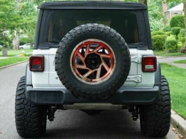 Красный Джип Вранглер, объемом двигателя 2 л и пробегом 57 тыс. км за 11000 $, фото 5 на Automoto.ua