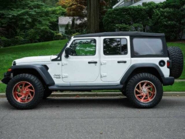 Красный Джип Вранглер, объемом двигателя 2 л и пробегом 57 тыс. км за 11000 $, фото 2 на Automoto.ua