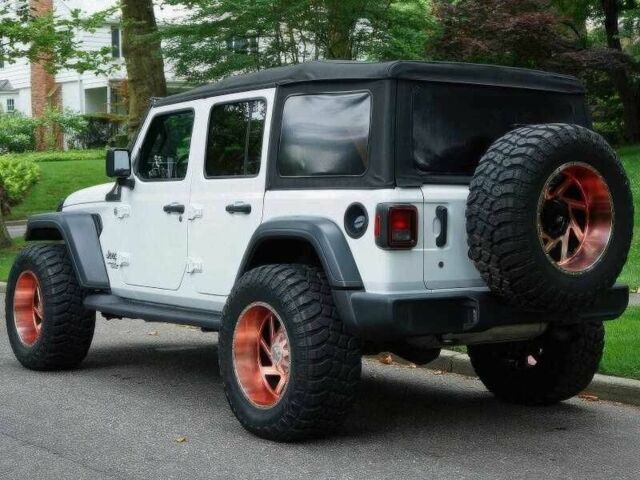 Красный Джип Вранглер, объемом двигателя 2 л и пробегом 57 тыс. км за 11000 $, фото 4 на Automoto.ua