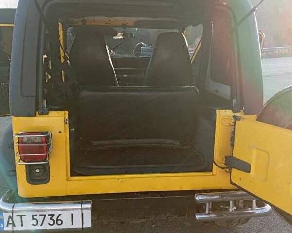 Желтый Джип Вранглер, объемом двигателя 2.5 л и пробегом 155 тыс. км за 8700 $, фото 7 на Automoto.ua