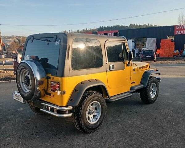 Желтый Джип Вранглер, объемом двигателя 2.5 л и пробегом 155 тыс. км за 8700 $, фото 3 на Automoto.ua