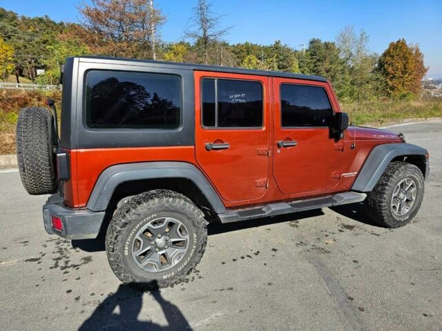 Оранжевый Джип Вранглер, объемом двигателя 2.7 л и пробегом 166 тыс. км за 6500 $, фото 2 на Automoto.ua