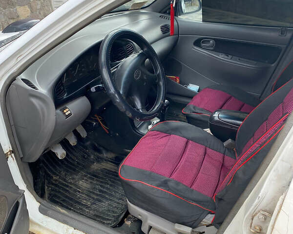 Белый Киа Авелла, объемом двигателя 1.5 л и пробегом 300 тыс. км за 1500 $, фото 5 на Automoto.ua