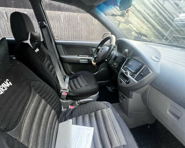 Бежевий Кіа Каренс, об'ємом двигуна 1.79 л та пробігом 292 тис. км за 3900 $, фото 5 на Automoto.ua