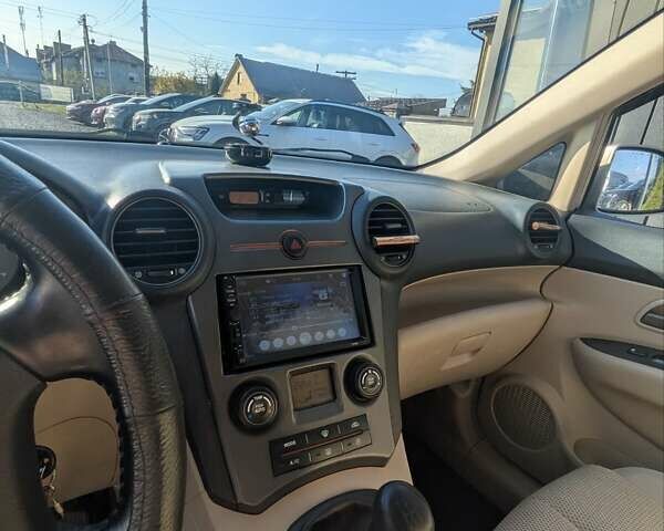 Бежевый Киа Каренс, объемом двигателя 2 л и пробегом 322 тыс. км за 5300 $, фото 10 на Automoto.ua