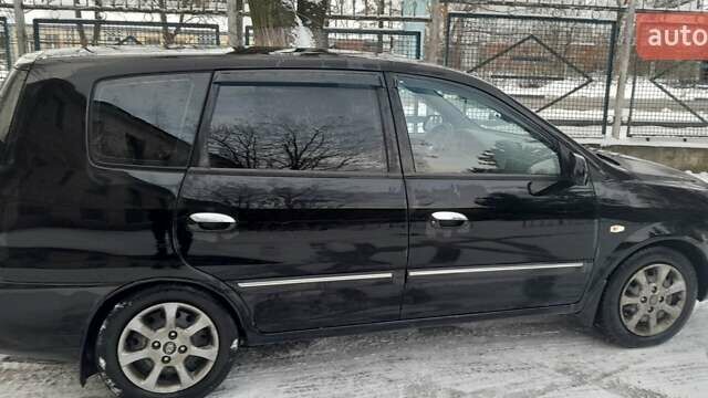 Черный Киа Каренс, объемом двигателя 2 л и пробегом 330 тыс. км за 4500 $, фото 4 на Automoto.ua