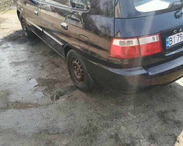 Чорний Кіа Каренс, об'ємом двигуна 1.8 л та пробігом 260 тис. км за 3618 $, фото 7 на Automoto.ua