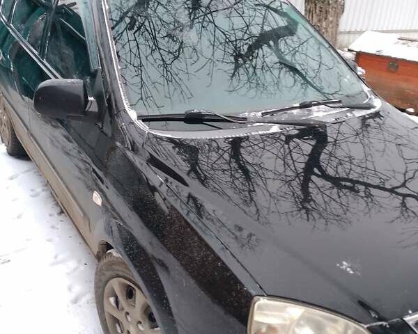 Черный Киа Каренс, объемом двигателя 2 л и пробегом 320 тыс. км за 5830 $, фото 9 на Automoto.ua