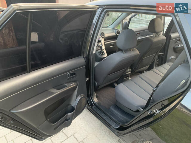 Чорний Кіа Каренс, об'ємом двигуна 2 л та пробігом 199 тис. км за 6400 $, фото 2 на Automoto.ua