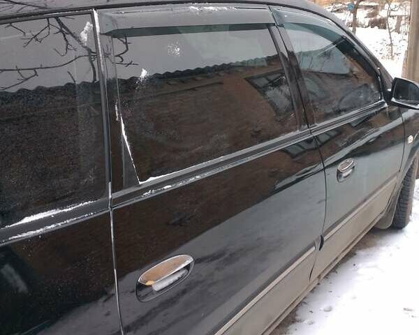 Черный Киа Каренс, объемом двигателя 2 л и пробегом 320 тыс. км за 5830 $, фото 3 на Automoto.ua