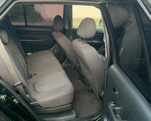 Чорний Кіа Каренс, об'ємом двигуна 2 л та пробігом 199 тис. км за 6400 $, фото 8 на Automoto.ua