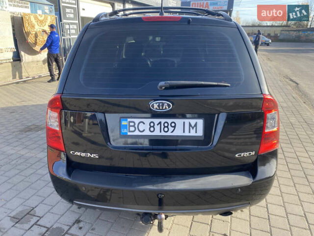 Чорний Кіа Каренс, об'ємом двигуна 2 л та пробігом 229 тис. км за 6900 $, фото 4 на Automoto.ua